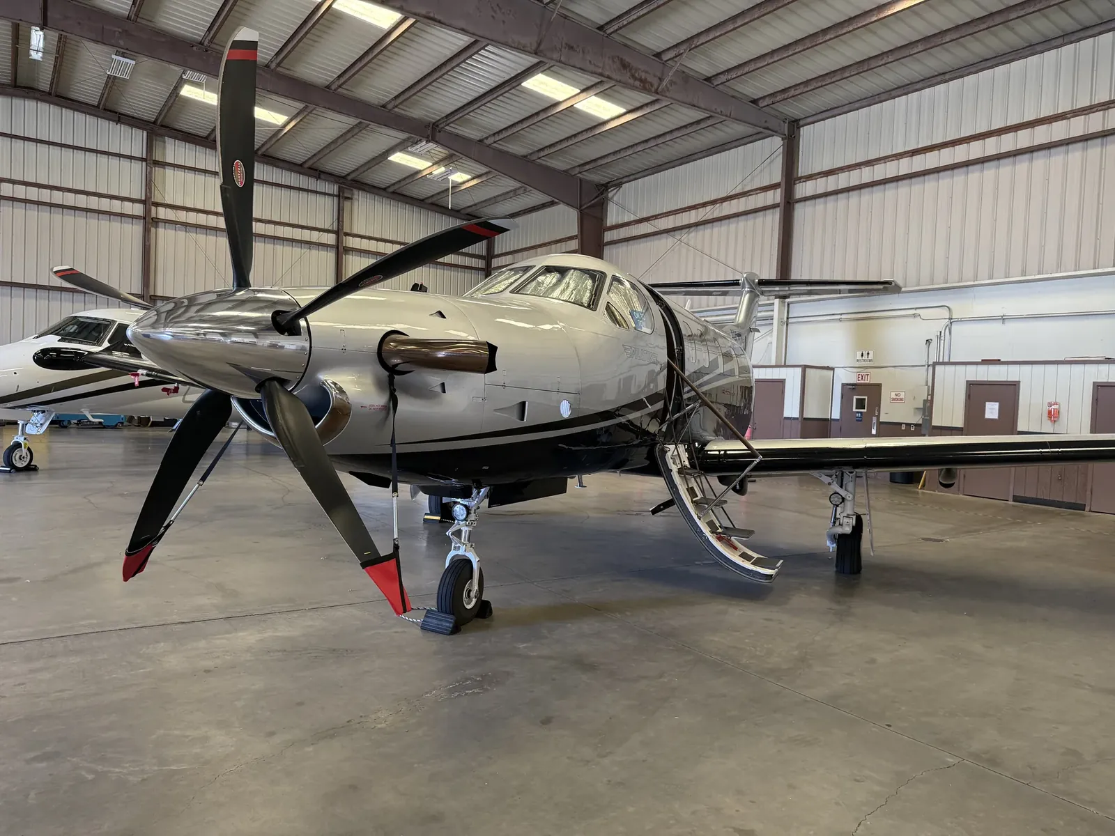 Turboprop aircraft inside a hangar after appearance-care work